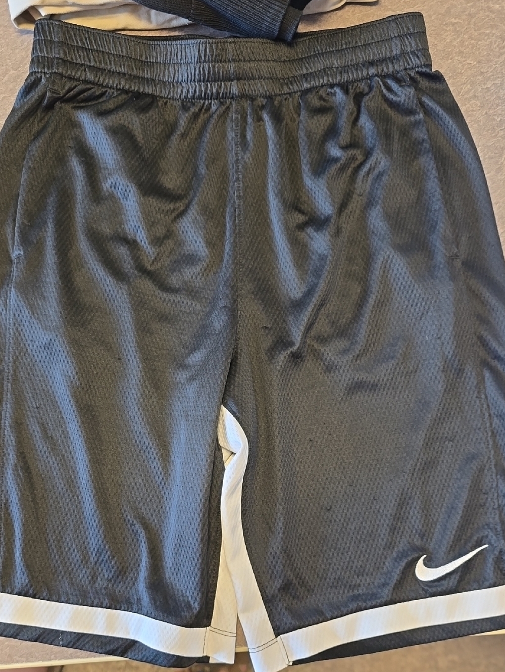 Nike Black Mesh Shorts with White Trim and Swoosh